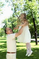 Naklejka premium Grandfather with granddaugther outside