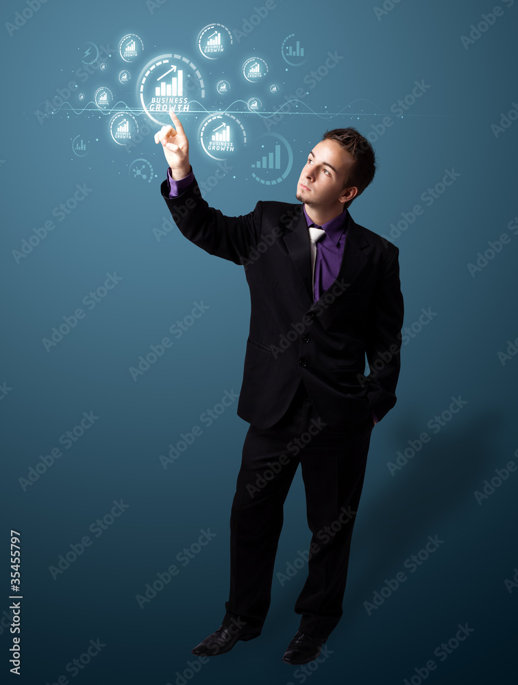 Wall mural businessman pressing modern business type of buttons