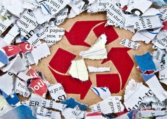 Recycle symbol with pieces of paper.