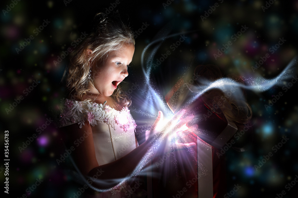 Wall mural Child opening a magic gift box