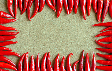Red chillies on cork background