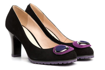 Pair of female shoes over white