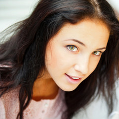 Closeup portrait of a beautiful young woman having a happy thoug