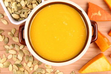 Pumpkin soup, pumpkin seeds and pieces of pumpkin