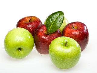 red and green wet apples on white background on the leaf