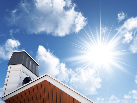 sun and blue sky over an house roof