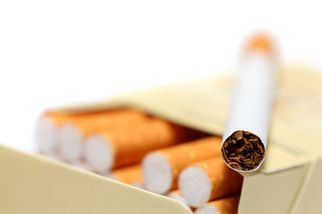 Close-up view on cigarette lying on pack