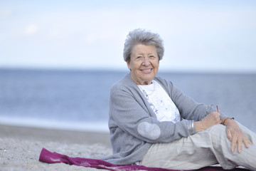 Fototapeta na wymiar Senior Woman by the Sea 5