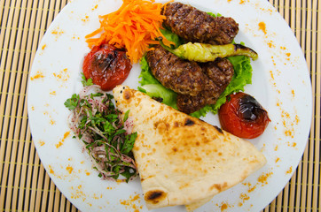 Meat cuisine - kebab served in plate