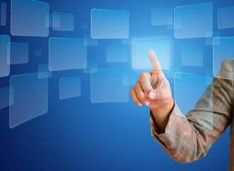 hand pushing a button on a touch screen interface