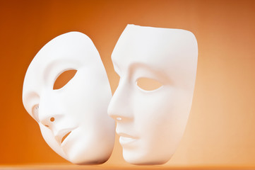 Theatre concept with masks against background