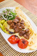 Kebab served in the plate