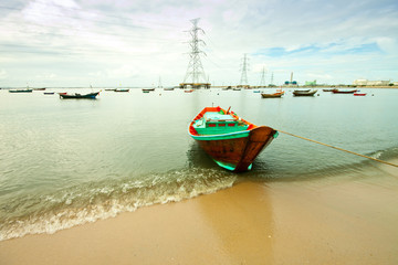 fishing boat with power plant background
