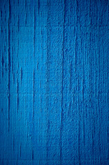 Blue paint on wood background