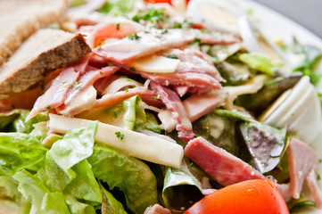 Fresh fruits salad and ham with tomatoes