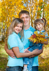 Fototapeta premium Young family, autumn