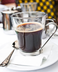 wonderful white cup of hot coffee on table