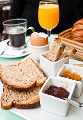 Breakfast with orange juice and fresh fruits on table