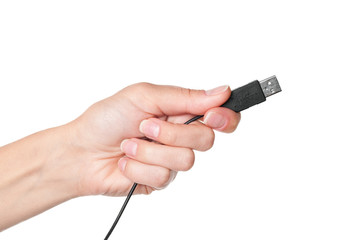 Hand holding black USB cable