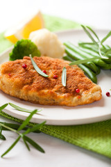 Breaded turbot  fillet with french beans and rosemary