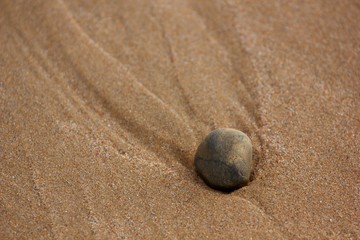 Fototapeta na wymiar Stone Making Pattern in Sand