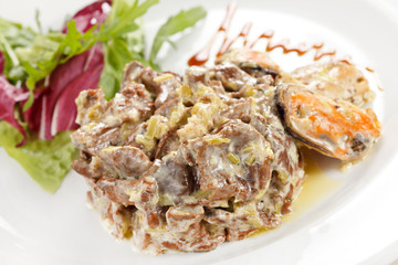 Fricassee with seafood and salad