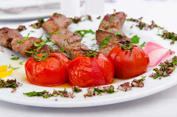 Meat kebab served in plate
