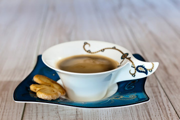 Coffee cup on white wood table