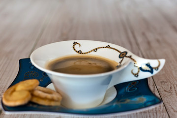 Coffee cup on white wood table