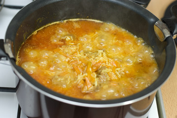 Rice, meat carrots and spices, cooking Uzbek pilaf.