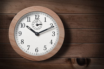 Clock on wooden wall.