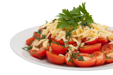 Red tomatoes from above are strewed by cheese