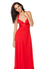 Fototapeta premium Beautiful female fashion model posing in red dress