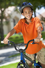 Naklejka premium African American Boy Child Riding Bike