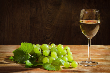 White grapes with glass of wine