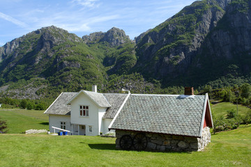 Fototapeta na wymiar traditional norwegian wooden house standing on a lawn