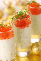 Appetizer with cream cheese and red caviar for Christmas table