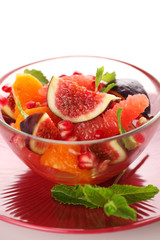Fresh salad with figs, grapefruit, tangerine and pomegranate