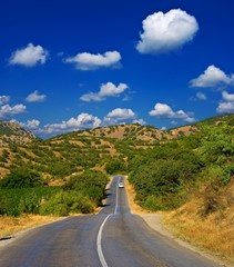 asphalt road among a hills