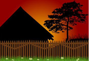 fence and house at sunset