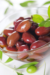 Black olives in oil closeup