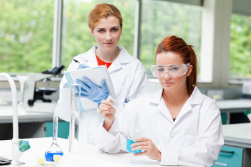 Fototapeta premium Cute science students doing an experiment