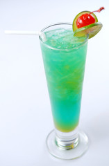 Closeup of a blue cocktail drink with lemon slices