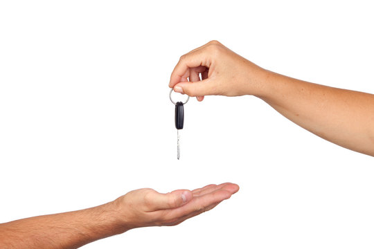 Hand giving car keys ...