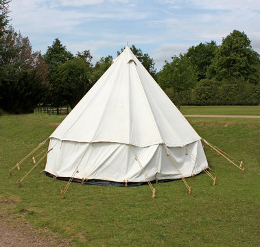 An Old Fashioned White Canvas Bell Camping Tent.
