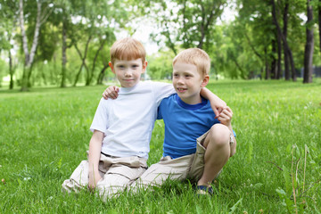 Naklejka na ściany i meble Portrait of two boys outdoors