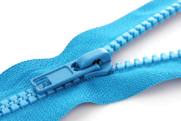 Blue zipper closeup isolated on white