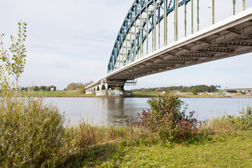 Old iron bridge crossing the river IJssel, the Netherlands
