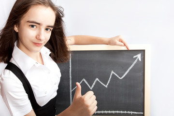 schoolgirl pointing to line graph
