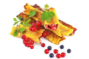 Pancakes with blueberries and red currants